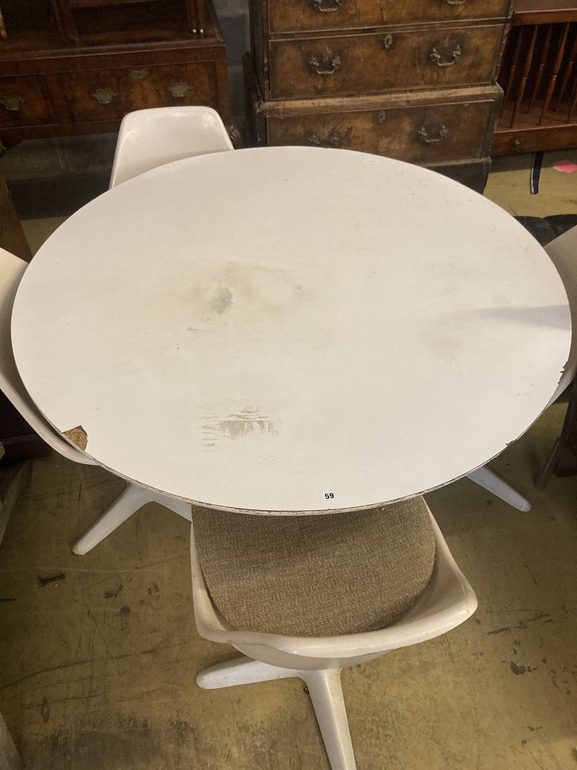 A circular tulip style table and four chairs, table diameter 121cm